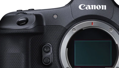 Canon mirrorless camera body with sensor visible and textured grip panel shown in close-up.