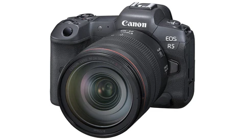 Canon EOS R5 mirrorless camera with attached zoom lens, displayed against white background.