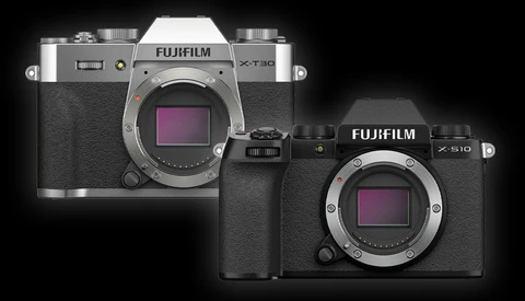 Fujifilm X-T30 and X-S10 mirrorless cameras displayed side by side against a black background.