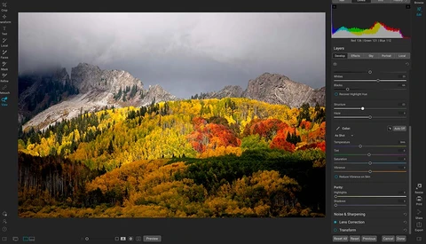 Screenshot of photo editing software showing autumn landscape with golden larch trees and snow-capped mountains.