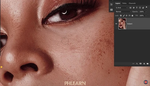 Close-up of a person's face showing skin texture, freckles, and natural makeup with a Photoshop workspace visible on the right side.