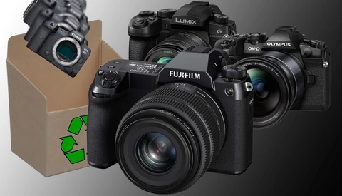 Illustration of four mirrorless cameras arranged around a cardboard box with a recycling symbol.