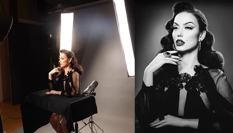 Behind-the-scenes studio portrait setup with subject positioned under bright panel lighting during professional photo shoot.