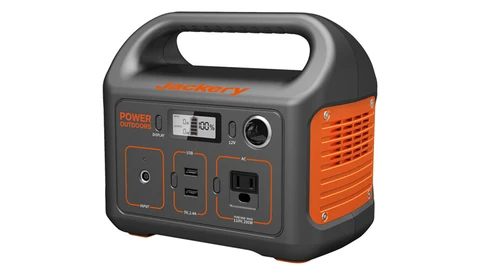 Portable power station with gray and orange casing, featuring digital display, multiple outlet types, and carry handle.