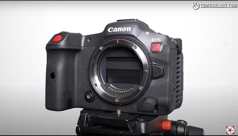 Canon EOS R5C cinema camera body mounted on a tripod head, viewed from the front-left angle against a white background.