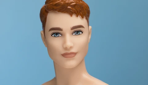 3D rendered portrait of a person with short auburn hair and blue eyes against a blue background.