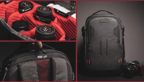 Professional camera backpack with modular red interior compartments and weatherproof exterior design.