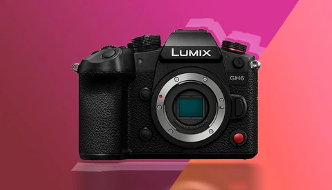 Panasonic Lumix GH6 mirrorless camera body against a vibrant gradient background.