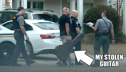 Meme graphic showing law enforcement officers at a residential property with an arrow pointing to a dark object labeled 'MY STOLEN GUITAR.'