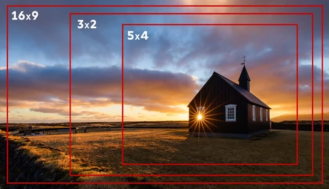 Red rectangular frames overlay an isolated wooden church silhouetted against a dramatic golden sunset sky.