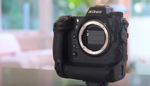 Nikon Z9 mirrorless camera body displayed against a blurred interior background.