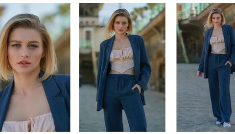 Female model in navy blazer and light crop top, photographed in three poses outdoors.