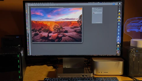 Screenshot of photo editing software displaying a landscape image with vibrant sunset colors and rocky terrain.