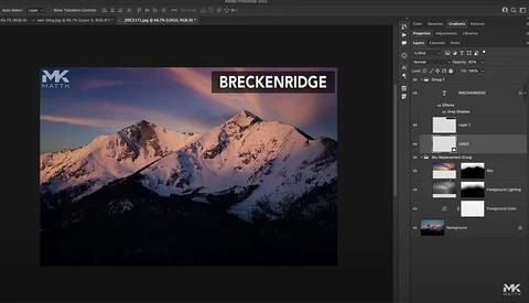 Snow-covered mountain peaks at sunset with warm golden light illuminating the slopes.