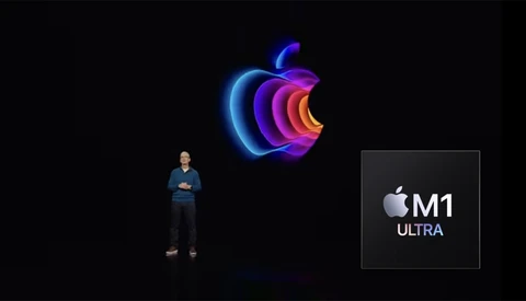 Apple M1 Ultra chip presentation graphic with colorful nested rings and processor logo against black background.