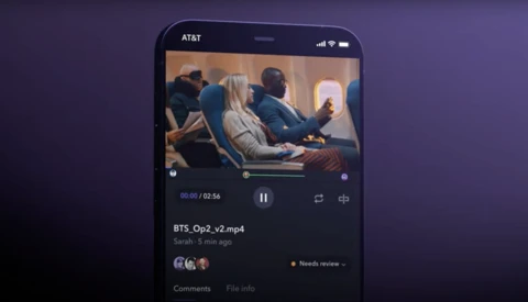 Screenshot of a video player app showing airplane cabin scene with playback controls and metadata.