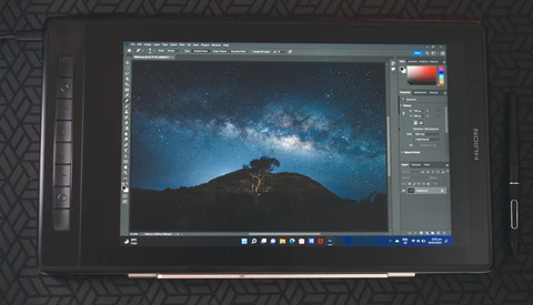 Screenshot of Photoshop displaying a nighttime landscape with silhouetted tree and Milky Way galaxy.