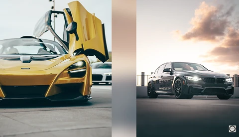 Yellow sports car with open scissor doors next to dark sedan under dramatic sunset clouds.