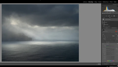 Screenshot of Lightroom's Develop module showing a moody seascape with dark clouds and calm water.