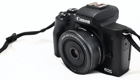 Canon EOS M50 Mark II mirrorless camera with 15-45mm lens on white background.