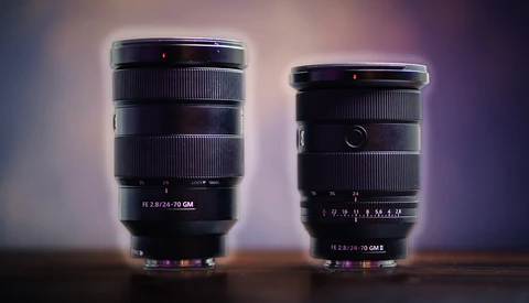 Two black camera lenses with macro focusing rings displayed side by side against a purple gradient background.