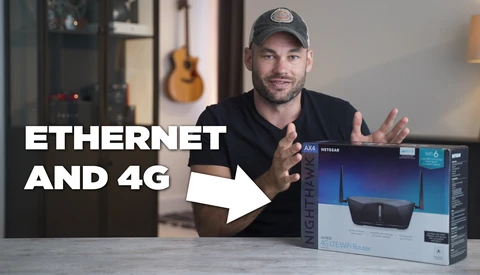 Man in black shirt and cap gestures toward a wireless router box on a table, with text overlay reading 'ETHERNET AND 4G'.