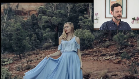 Woman in flowing light blue dress posing in natural landscape with man in dark patterned shirt visible in inset.