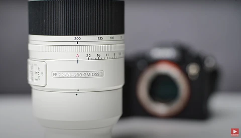 Sony FE 2.8/70-200 GM OSS II telephoto lens with focus ring and distance scale visible.