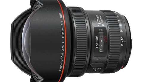 Canon EF 12-24mm f/4L USM ultra-wide zoom lens with hood attached, shown in product photography style.