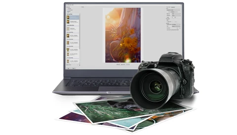Professional DSLR camera with telephoto lens positioned next to a laptop displaying photo editing software and printed photographs.