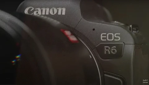 Close-up of Canon EOS R6 mirrorless camera body showing branding and model designation.