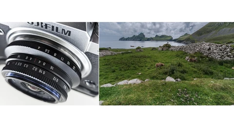 Close-up of vintage rangefinder camera lens with manual focus and aperture rings.