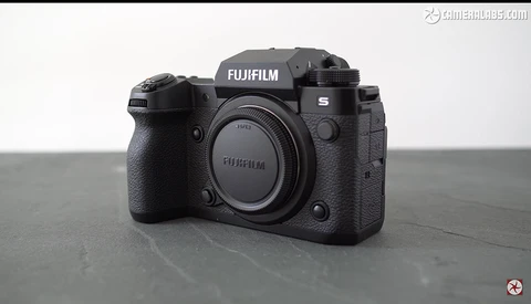 Fujifilm S mirrorless camera body shown from front-center angle against neutral gray background.