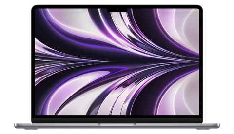 Screenshot of a laptop displaying abstract purple and black flowing wave patterns on its display.