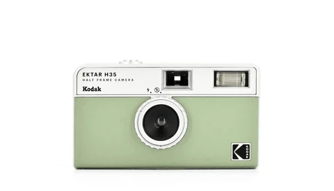 Kodak Ektar H35 half-frame film camera in sage green with chrome accents and viewfinder ports.