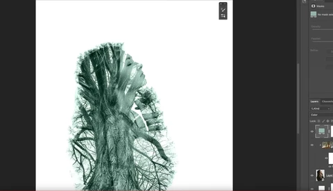 Double exposure portrait blending a woman's profile with leafless tree branches in green tones.