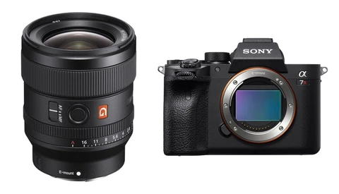 Sony Alpha 7r mirrorless camera body next to a fast prime lens with autofocus motor.