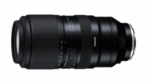 Tamron telephoto zoom lens with ribbed rubber focus and zoom rings against a white background.