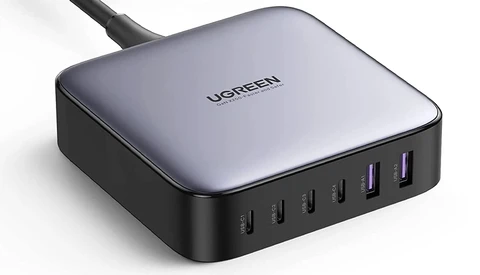 Ugreen desktop charging station with multiple USB ports and cables arranged against white background.