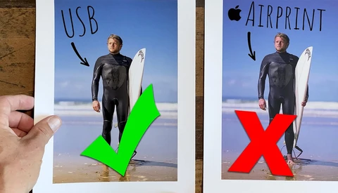 Comparison graphic showing a surfer with surfboard on a beach with USB label and green checkmark versus Apple Airprint label and red X.