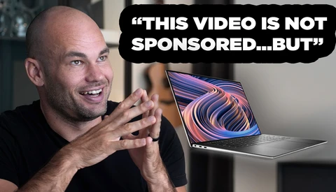 Man speaking to camera next to laptop displaying colorful abstract design, with speech bubble text about video sponsorship.