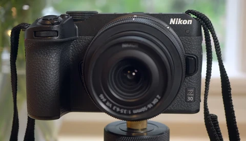 Nikon Z30 mirrorless camera mounted on a tripod with a telephoto lens attached.