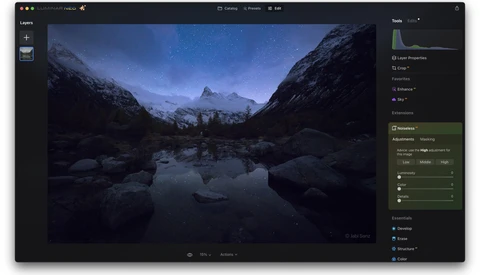Screenshot of photo editing software showing a nighttime mountain landscape with reflective water.