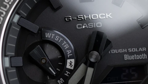 Close-up detail of a G-Shock Casio watch face showing Tough Solar and Bluetooth features.