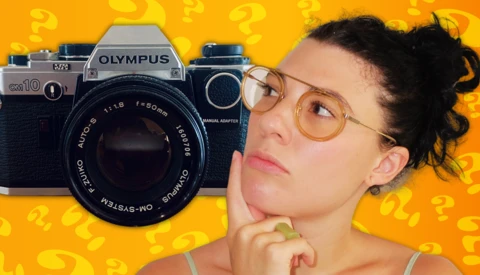 Thoughtful person wearing glasses beside vintage Olympus film cameras against yellow background with question marks.