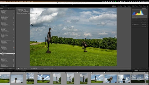 Lightroom Classic interface displaying landscape photo of person with bicycle in green field under cloudy sky.