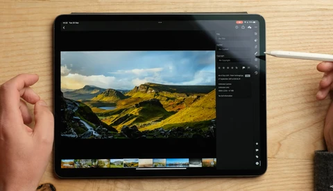 Screenshot of photo editing software displaying a landscape image of golden hills with a stream and blue sky.