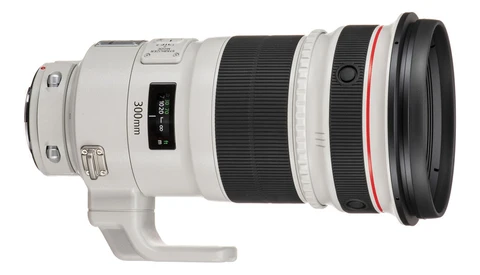 Canon EF 300mm f/2.8L IS USM telephoto lens with white barrel and tripod collar.