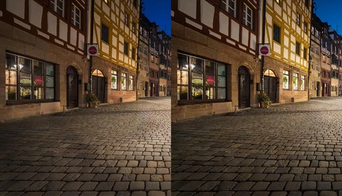 Side-by-side comparison of the same European street scene at night showing different color grading approaches.