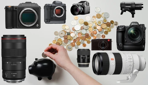 Photography equipment collection displayed flat lay with coins pouring from piggy bank.